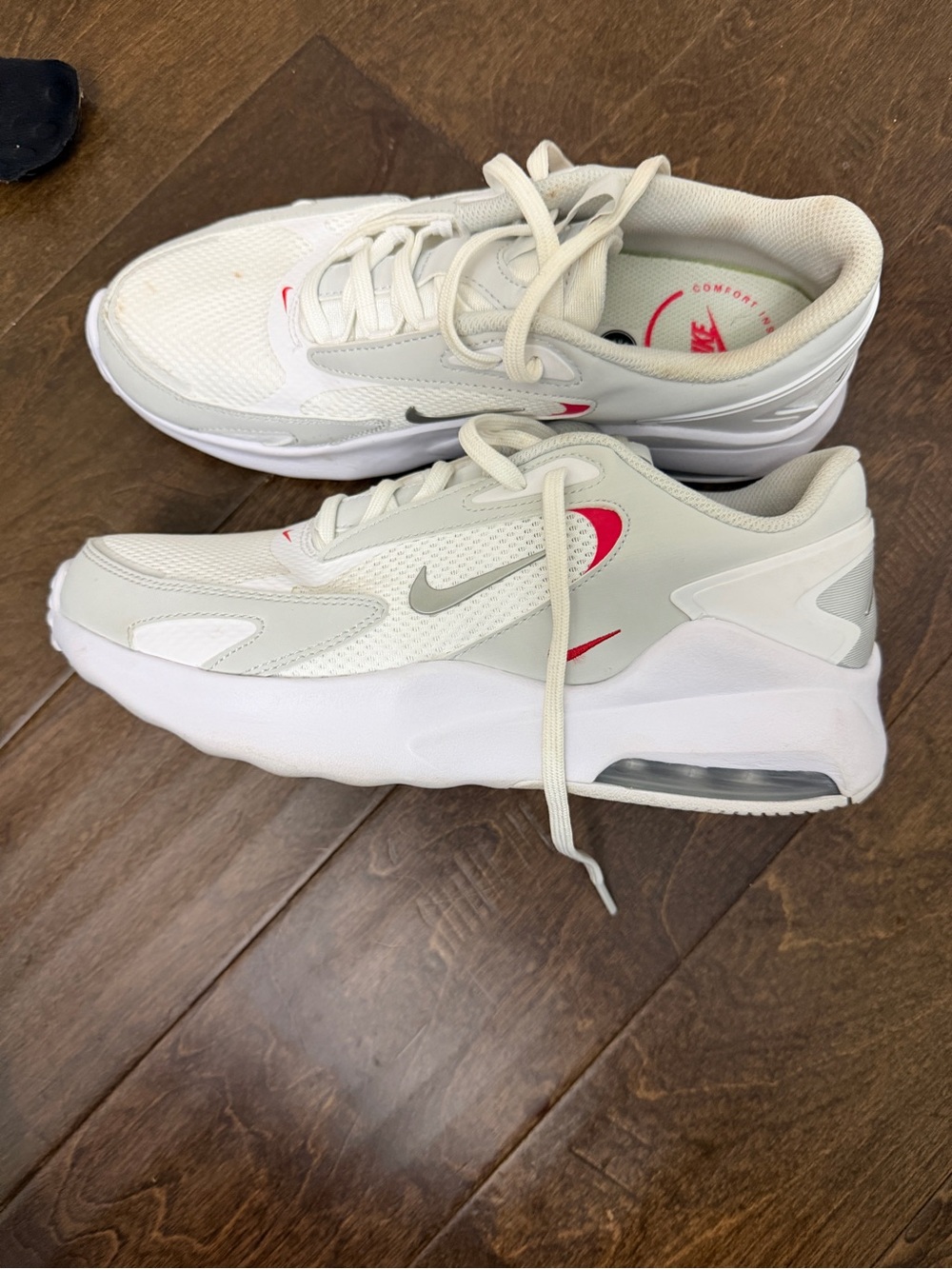 Nike women’s White & Gray Air Cushion Sneakers with Pink Accents